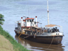 Argentina - Puerto Iguazu - barge on Iguazu River - images of South America by M.Bergsma