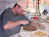 Azerbaijan - Baku: potter finishing a picture of Baku - pottery on the road to the airport - artisan - clay - photo by F.MacLachlan