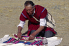 Isla del Sol, Lake Titicaca, Manco Kapac Province, La Paz Department, Bolivia: a kallawayas (shaman) performs a koada (offering) to Pancha Mama (Mother Earth) - photo by C.Lovell