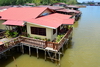 Bandar Seri Begawan, Brunei Darussalam: red roofed buildings of Kampong Ujong Bukit water village - photo by M.Torres