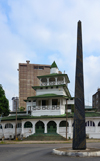 Cameroon, Douala: the Pagoda, Palace of the Kings Bell and stone obelisk, the Sud-Obelisk, by Faouzi Laataris, erected for the SUD Salon Urbain de Douala - Government Square - administrative quarter, Bonanjo - photo by M.Torres