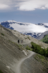 Torres del Paine National Park, Magallanes region, Chile: trail to the Towers of Paine with view of Andes peak - hikers in Chilean Patagonia - photo by C.Lovell