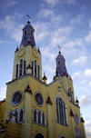 Castro, Chilo island, Los Lagos Region, Chile: twin church steeples of San Francisco de Castro church built in 1906  colourful wooden church by architect Eduardo Provasoli - Unesco world heritage site - Iglesia Apstol Santiago - photo by C.Lovell