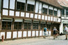 Odense, Funen island, Syddanmark, Denmark: people walking their bikes in front of a timber structure building - photo by K.Gapys