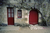 Chenonceaux, Indre-et-Loire, Centre, France: winery with red door and purple wisteria - Loire Valley - photo by C.Lovell