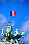 Paris, France: southeast corner of the Grand Palais - quadriga and the French flag - gravity defying sculpture 'LHarmonie triomphant de la Discorde' by Georges Rcipon - 8e arrondissement - photo by M.Torres