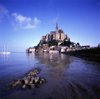 Mont Saint-Michel, Manche, Basse Normadie, France: the Abbey and the islet - sail boat and wind surfer at mouth of the Couesnon River - UNESCO World Heritage Site - photo by J.Fekete