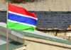 Banjul, The Gambia: flag of Gambia and zinc roofs - three horizontal red, blue and green bands separated by two thin white fimbriations - photo by M.Torres