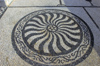 Greece, Halki, Emborios:the fine details of the hohlaki pebbling can be seen here in this fineexample at Emborios' church courtyard - photo by P.Hellander