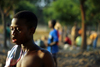 Bissau, Guinea Bissau / Guin Bissau: Bandim quarter, Carnival Masks, child after a football match / Bairro Bandim, mscaras de carnaval, preparao, criana depois de um jogo de futebol - photo by R.V.Lopes