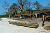 Rubane Island, Bijags Archipelago - UNESCO biosphere reserve, Bubaque sector, Bolama region, Guinea Bissau / Guin Bissau: village scene, wood and straw huts, beach, child, canoe, everyday life / aldeia, casas de madeira e palha, praia, criana, canoa, vida quotidiana - photo by R.V.Lopes