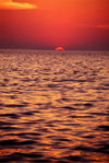 Goa, India: sunset on the Arabian sea with a ship just in front of the sun - from Goa beach - photo by E.Petitalot