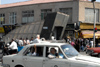 Iran - Tehran - Paykan car in traffic and metro entrance - photo by M.Torres