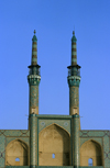 Yazd, Iran: twin minarets of the Takyeh Amir Chakhmagh complex - a medieval gate from the original walled city - photo by W.Allgower