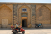 Iran - Shiraz: scooter passing by the Vakil baths, now a restaurant - photo by M.Torres