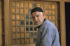 Iran: man entering a mosque - photo by W.Allgower