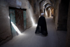 Yazd, Iran: Mullah walking along a covered street in the historical area - photo by G.Koelman