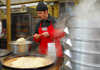 Kazakhstan, Almaty: preparing plov - food for sale - photo by M.Torres