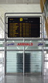 Erbil / Hewler, Kurdistan, Iraq: Erbil International Airport terminal building - door to Kurdistan, the gate of the international arrivals and arrivals board - photo by M.Torres