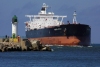 Latvia - Ventspils: the Mayon Spirit enters the harbour - lighthouse - oil tanker (photo by A.Dnieprowsky)