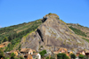 RN2, Alaotra-Mangoro region, Toamasina Province, Madagascar: village under a giant rock pyramid - photo by M.Torres