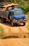 West coast road between the Manambolo river and Belon'i Tsiribihina, Toliara Province, Madagascar: a Taxi Brousse negotiates a small river - Mercedes-Benz truck  - photo by M.Torres