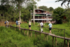 Rajang River, Sarawak, Borneo, Malaysia: passengers go ashore at a remote village - RV Orient Pandaw in background - rickety pier - photo by R.Eime