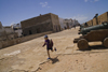 Mogador / Essaouira - Morocco: cannons on the ramparts - local boy running - photo by Sandia