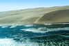 Namibia: Aerial view of Skeleton Coast where ocean meets sand dunes, Kunene region - photo by B.Cain