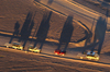 Namibia: Aerial View of Hot Air Balloon Chase vehicles - long shadows  just after sunrise, Sossusvlei - photo by B.Cain