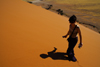 Namib Desert - Sossusvlei, Hardap region, Namibia: traveller - sun and shadow - photo by Sandia