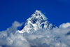 Nepal, Pokhara: view of Machhapuchhare peak above clouds - photo by J.Pemberton