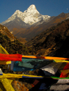 Khumbu region, Solukhumbu district, Sagarmatha zone, Nepal: prayer flags and Ama Dablam mountain, 6,812 m - the 'Mother and Pearl Necklace' - photo by E.Petitalot