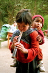 Nepal - Annapurna region: girl playing xaphoon - photo by G.Friedman