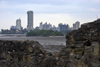 Panama City: ruins of Panama la Vieja (Old Panama) frame the luxurious buildings of Punta Paitilla, where the merchants and bankers that control Panama live, surrounded by the pollution of the Panama Bay - an ongoing project attempts to clean the bay - photo by H.Olarte