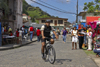 A bike-mounted policeman patrols the street near the Portobello Customs House during the devil and congo festival - photo by H.Olarte