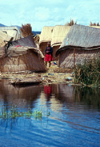 Lake Titicaca - Puno region, Peru: Uros girl on a floating islet - indigenous village - photo by J.Fekete