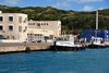 Port Mathurin, Rodrigues island, Mauritius: tugboats docked in the harbor - shipping containers in the background - photo by M.Torres