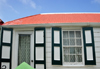 Windwardside, Saba: creole cottage with green shutters and traditional curtains - photo by M.Torres