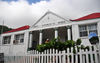 The Bottom, Saba: Dutch colonial architecture - Department of Public Works, a former schoolhouse  - picket fence - photo by M.Torres