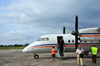 So Tom, gua Grande district, So Tom and Prncipe / STP: So Tom International Airport - passengers arrive from Libreville - Air Service Gabon De Havilland Canada DHC-8-102 Dash 8 TR-LHA, cn 128 / passageiros chegam de Libreville - Aeroporto Internacional de So Tom - photo by M.Torres