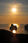 Porto Flavia, Masua, Sardinia / Sardegna / Sardigna: Sugar Loaf islet / Scoglio Pan di Zucchero at sunset - limestone stack on the Gonnesa gulf - photo by M.Torres