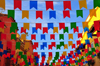 Pula, Cagliari province, Sardinia / Sardegna / Sardigna: street covered in banners - Sant'Efisio celebrations - photo by M.Torres