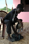 Cap Skirring, Oussouye, Basse Casamance (Ziguinchor), Senegal: Fisherman's restaurant, man showing the fresh fish, everyday life / Restaurante de um pescador, pescador mostrando o peixe fresco, vida quotidiana - photo by R.V.Lopes