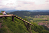 a couple enjoys the view towards the Kamnik Mountains - Smarna Gora mountain on the outskirts of Ljubljana, Slovenia - photo by I.Middleton