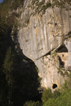 Cave entrance and valley underneath Predjama castle , Slovenia - photo by I.Middleton