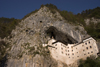 cliff and Predjama castle, Slovenia - photo by I.Middleton