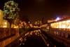 Ljubljanica River and Plecnik's Market Arcades - city center lit up at night for Christmas, Ljubljana, Slovenia - photo by I.Middleton