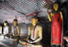 Dambulla, Central Province, Sri Lanka: line of Buddhas along a cave wall - Golden Temple of Dambulla - UNESCO World Heritage Site - photo by M.Torres