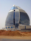 Khartoum, Sudan: Burj Al-Fateh Hotel,  in the shape of a boat with a full sail, known as 'Gaddafi's Egg' - Libyan financed hotel located near Tuti island, at the meeting point of the Blue Nile and White Nile - photo by L.Gewalli